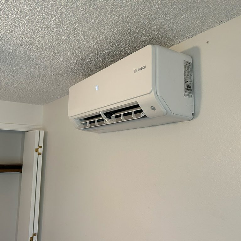 Bosch ductless mini split ac mounted in a bedroom. Installed by SureTech Heating & Cooling.